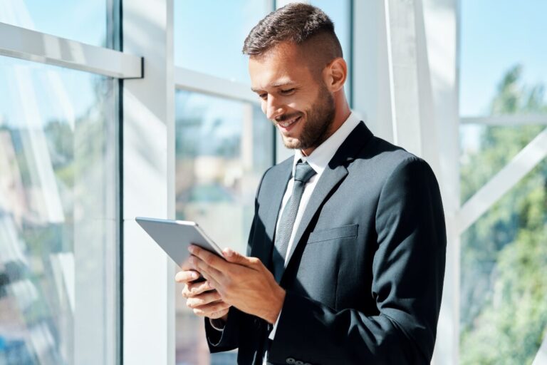 Man in using holding a tablet